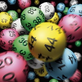 Multiple lottery balls, full frame, close-up (blurred motion)
